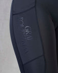 A close up of the phone pocket and subtle Grey Equestrian branding.