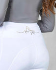 A model wearing our white competition leggings.